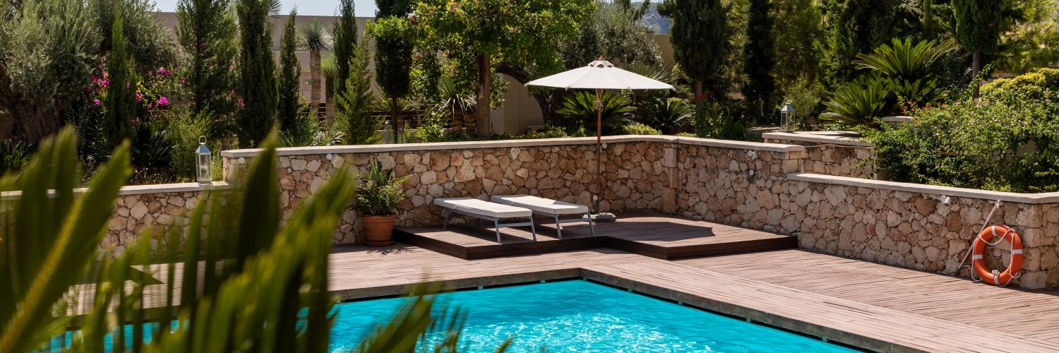 white umbrella by the swimming pool