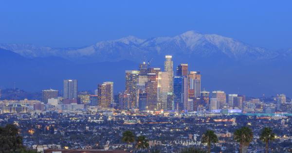 A view of the Los Angeles skyline with snow-topped mountains in the background A view of the Los Angeles skyline with snow-topped mountains in the background