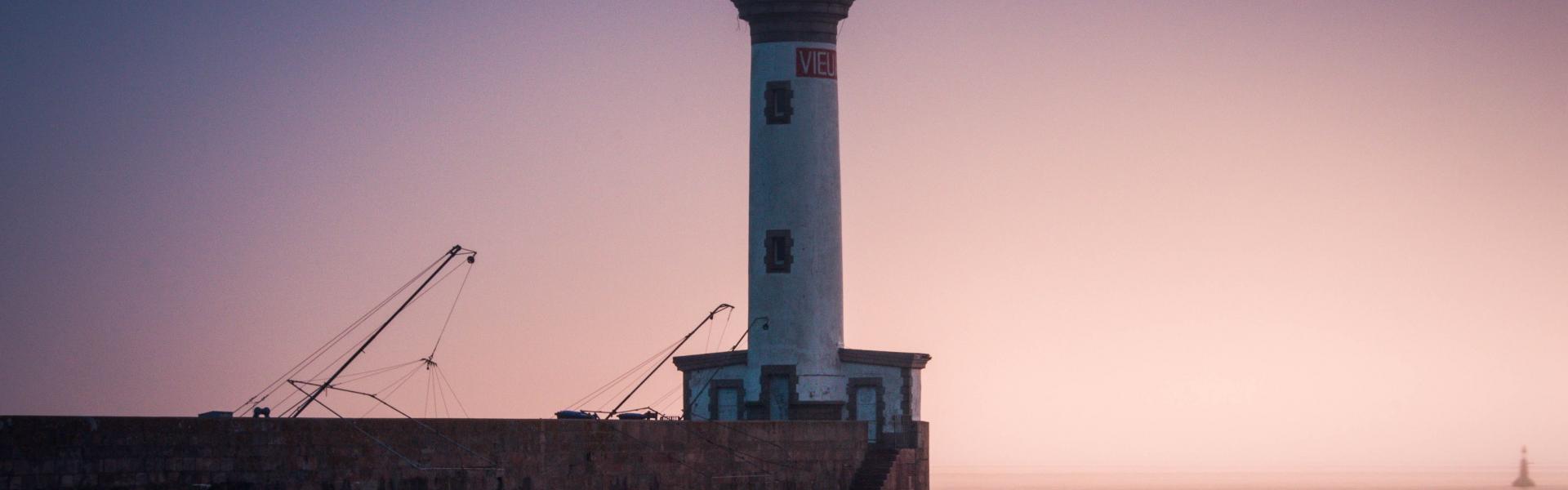 white lighthouse during golden hour