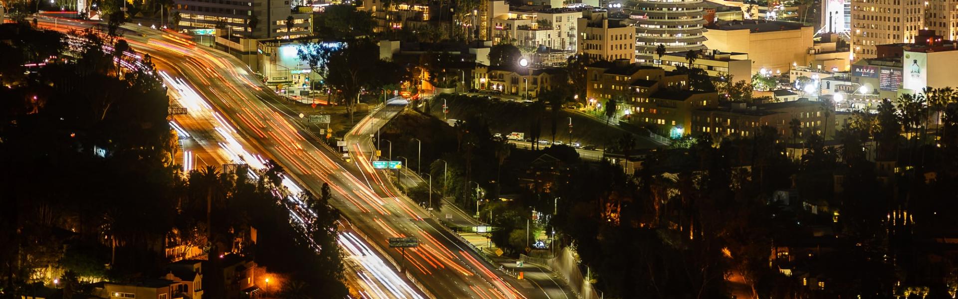 time lapse photography of vehicle on road